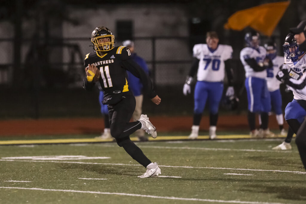 Monroe City’s Joshua Talton (11) runs the ball during the district championship game between the Monroe City Panther and the Mark Twain Tigers in Monroe City Friday.  Mathew Kirby/Herald Whig-Courier Post