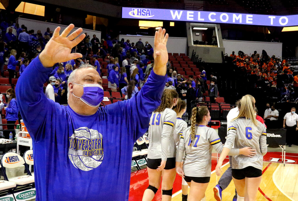 November 12, 2021 - Normal, Illinois - SHS head volleyball coach Tim Kerr acknowledges the team's fans after winning their semifinal match against Springfield Lutheran at the Illinois High School Association Volleyball State Finals. The Lady Suns advanced to the Class 1A state title match tomorrow after defeating Crusaders in straight sets, 25-16, 25-23.  (Photo: PhotoNews Media/Clark Brooks)