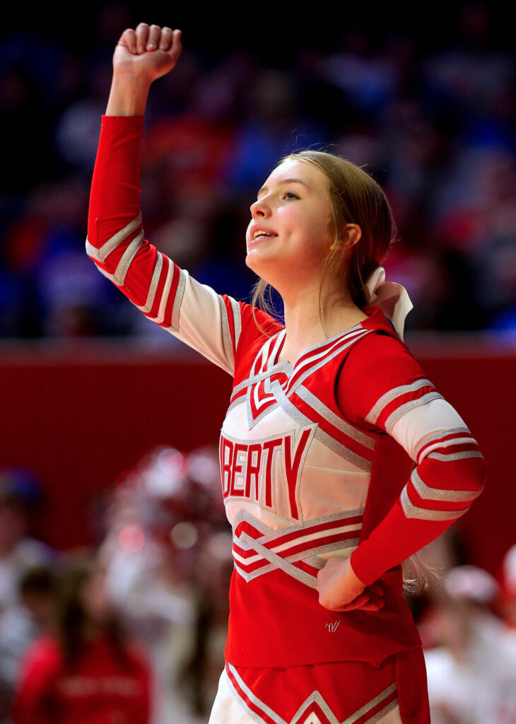 March 12, 2022 - Champaign, Illinois - A Liberty cheerleader cheers during a timeout during their team's Class 1A state championship basketball game against Yorkville Christian. The Eagles fell to the Mustangs, 54-41.   (Photo: PhotoNews Media/Clark Brooks)