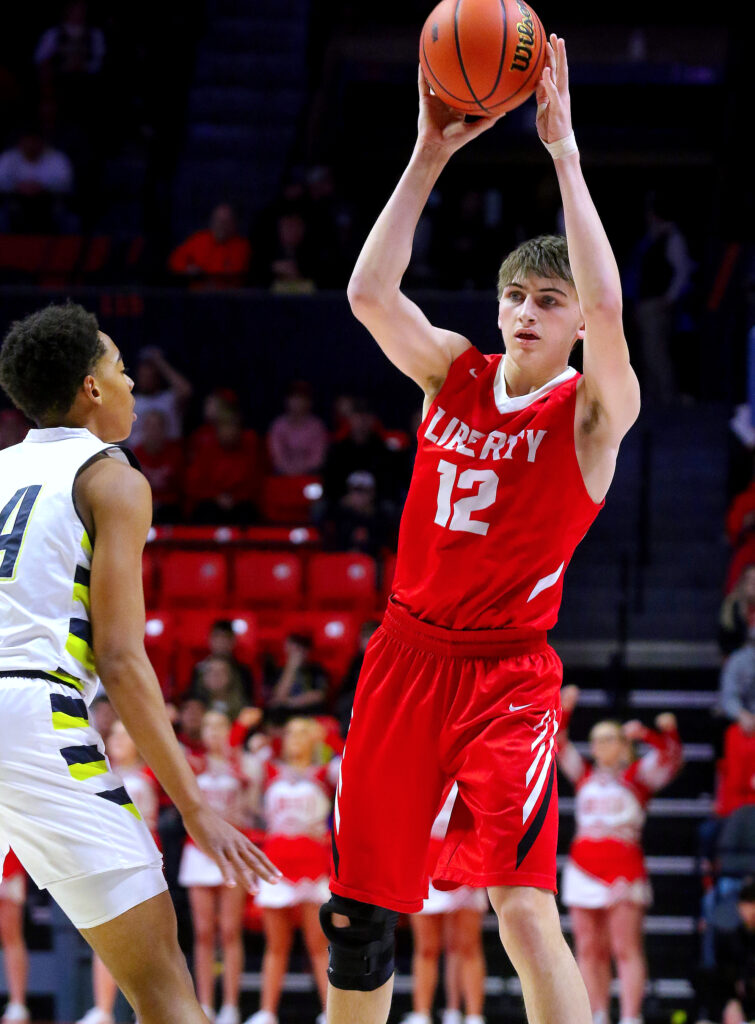 March 12, 2022 - Champaign, Illinois - Liberty's Logan Robbins looks to make a pass during first half action of their Class 1A state championship basketball game against Yorkville Christian. The Eagles fell to the Mustangs, 54-41.   (Photo: PhotoNews Media/Clark Brooks)