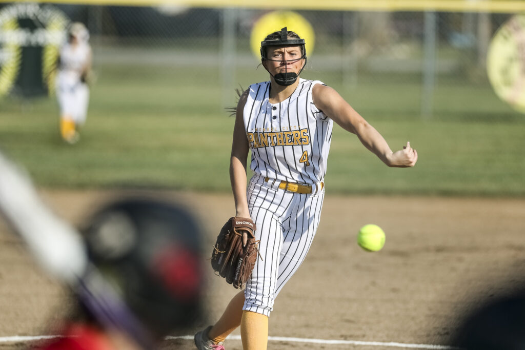 Monroe City’ Lucy Pratt (4) delivers a pitch, during the Panthers game against the Pirates in Monroe City tournament, Saturday.  Mathew Kirby/Herald Whig-Courier Post