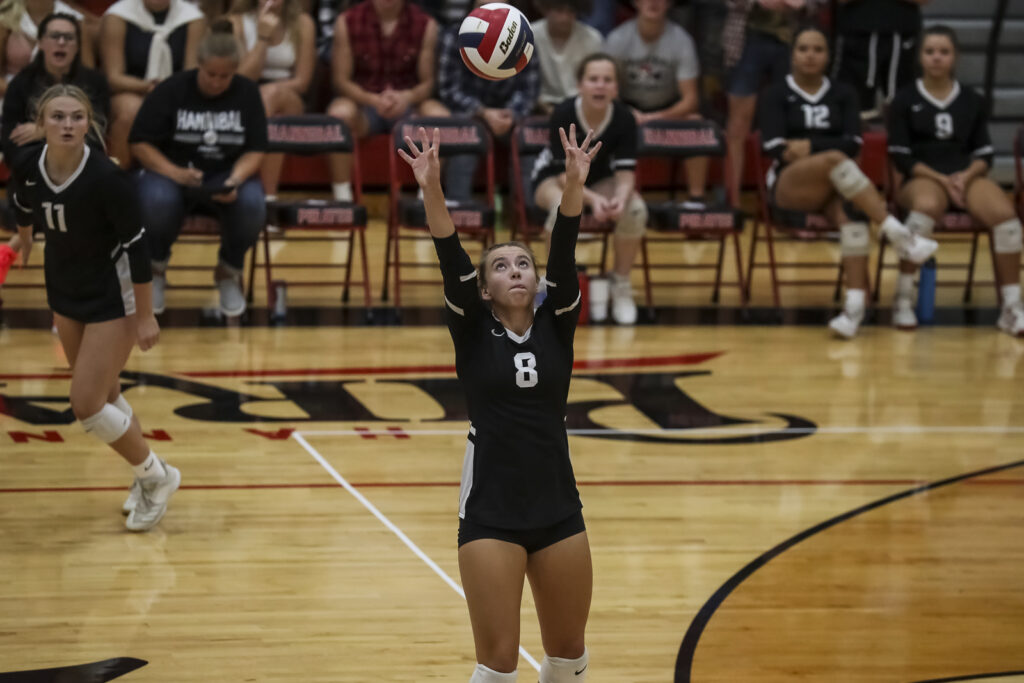 Hannibals’ Nora Hark (8) sets the ball during the Pirates match against QND, Tuesday in Hannibal.  Mathew Kirby/Herald Whig-Courier Post