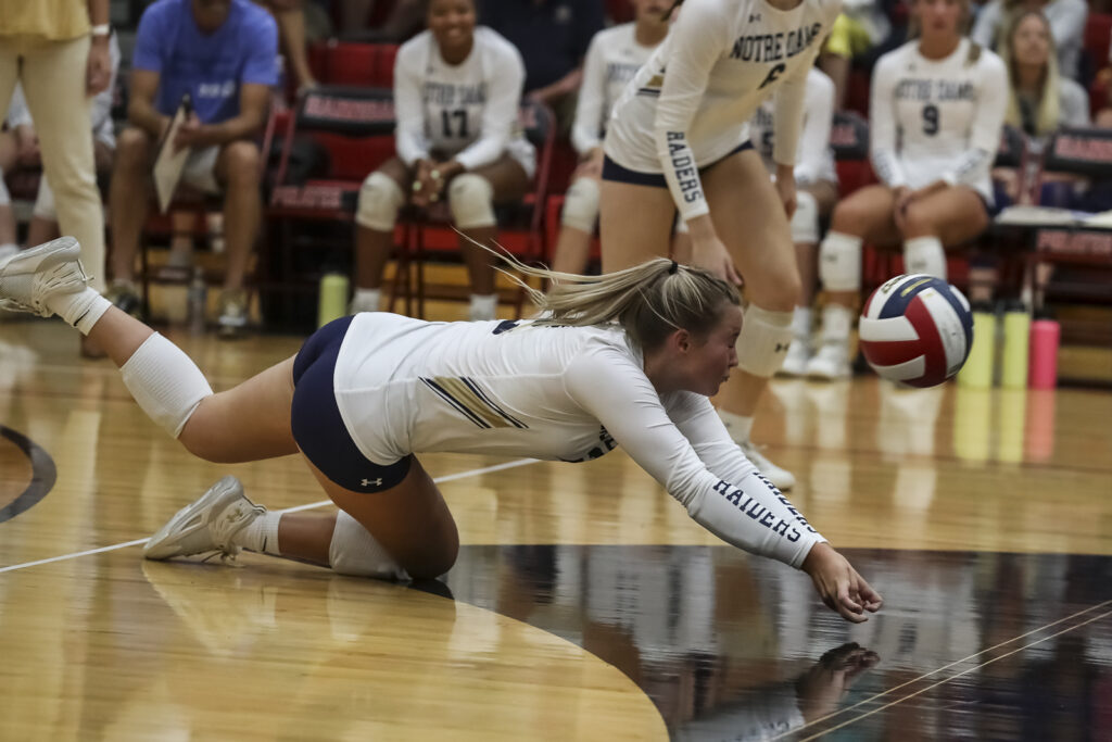 QNDs’ Lilly Marth (2) dives to dig the ball during the Raiders match against Hannibal, Tuesday in Hannibal.  Mathew Kirby/Herald Whig-Courier Post