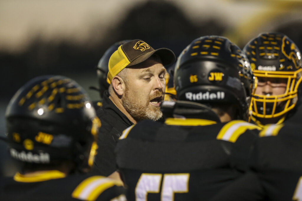 Monroe City head coach Davis Kirby talks to his players during the Panthers district game against Paris, in Monroe City Friday.  Mathew Kirby/Herald Whig-Courier Post