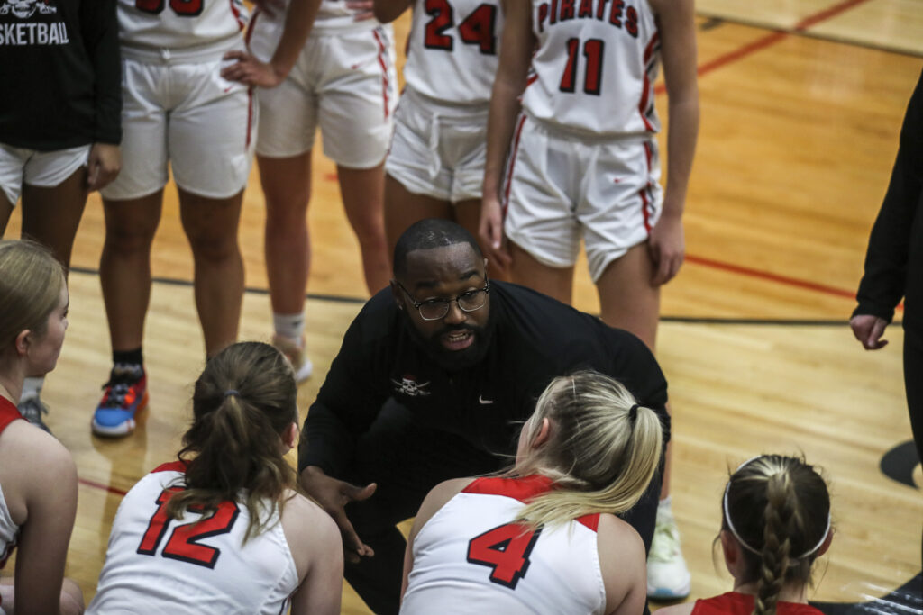 Hannibal coach Shawn Gaines talks to his team during a times out of the Pirates game against the Bowling Green Bobcats, Monday in Hannibal.  Mathew Kirby/Herald Whig-Courier Post