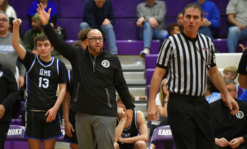 Quincy head coach Andy Douglas questions the lack of a call against Rockford East. Quincy played Rockford East in a semifinal game at the Collinsville Prairie Farms Holiday Classic basketball tournament at Collinsville High School in Collinsville, IL on Thursday December 29, 2022.  
Photo Courtesy Tim Vizer Photography