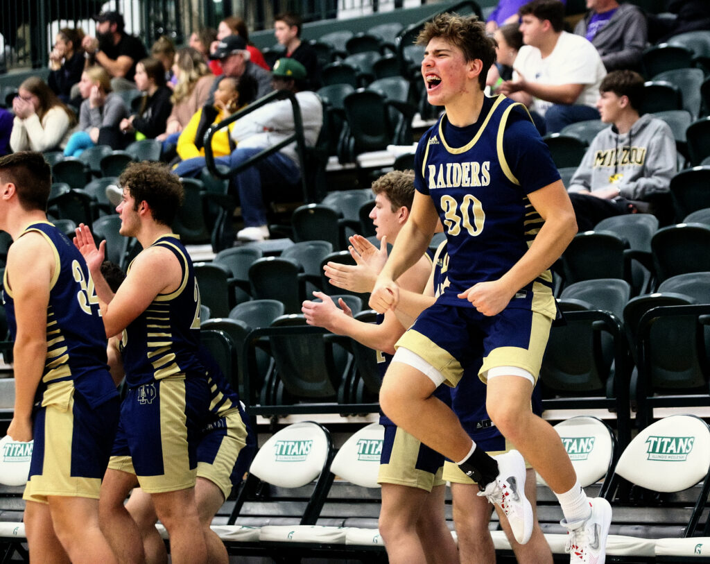 December 29, 2022 - Bloomington, Illinois - Notre Dame's Noah Lunt leaps for joy after his team takes the lead against El Paso-Gridley in the fourth quarter on Thursday at the State Farm Holiday Classic. The Raiders pulled off a come-from-behind 49-46 win at the Shirk Center over the Titans. (Photo: PhotoNews Media/Clark Brooks)