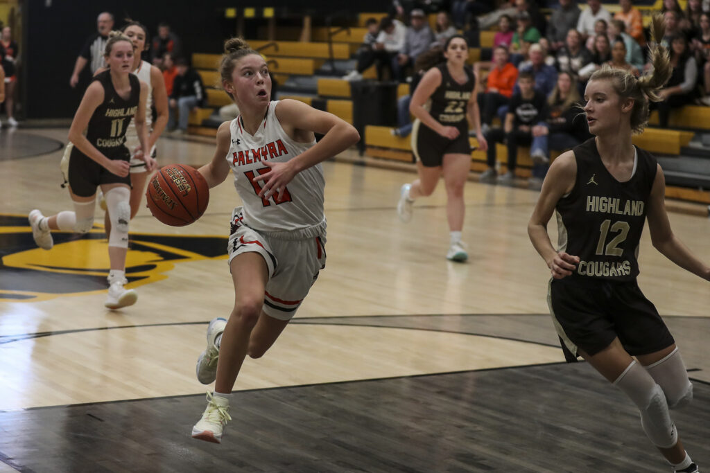 Palmyra’s Clare Williams (10) drives down the lane on a fast break during the Panther’s semifinal game against Highland in the of the 98th Annual Monroe City basketball tournament.  Mathew Kirby/herald Whig-Courier Post