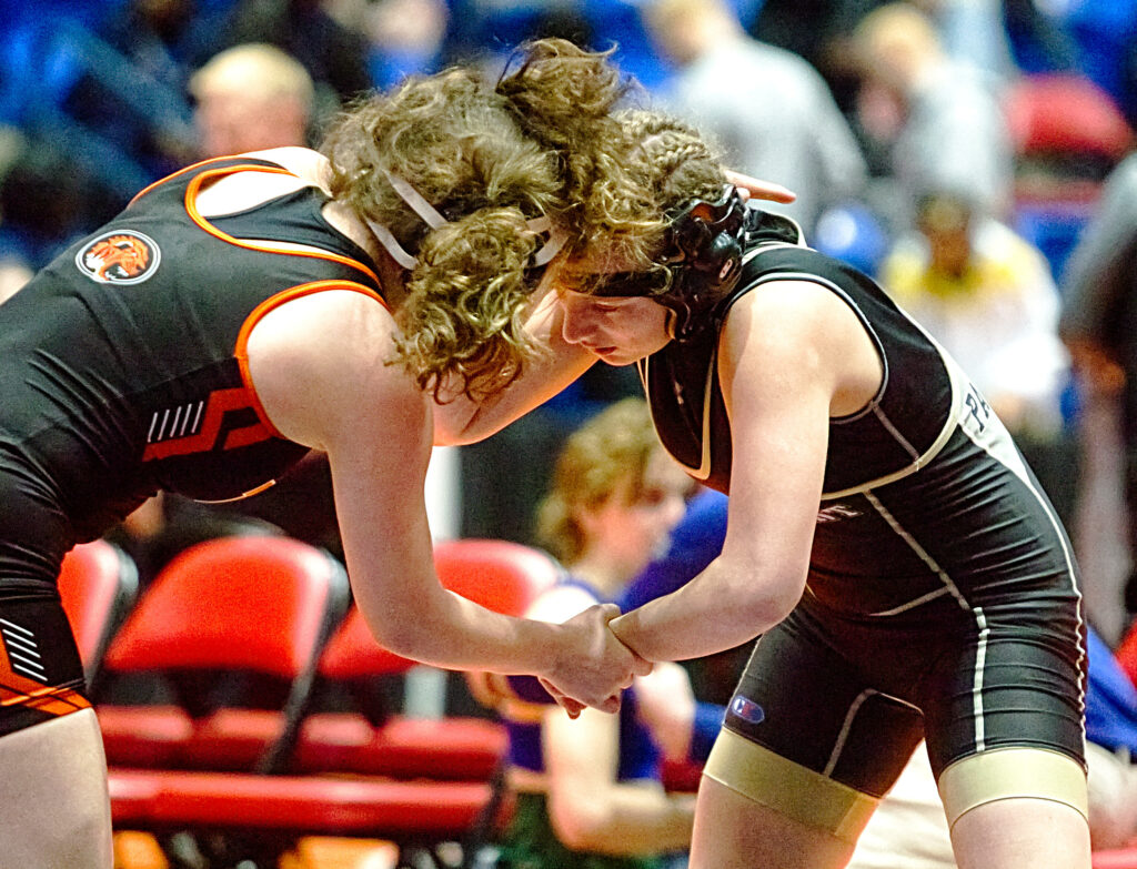February 24, 2023 - Bloomington, Illinois - 
Edwardsville's Holly Zugmaier wrestles Camp Point Central's Amber Louderback (right) during their 125-pound match at the 2023 IHSA Girls Individual Wrestling State Finals on Friday. Louderback advanced to the quarterfinals after a 7-5 decision. (Photo: PhotoNews Media/Clark Brooks)