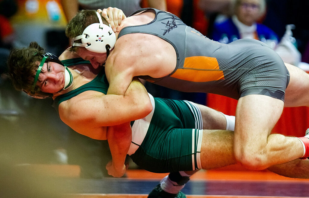 February 18, 2023 - Champaign, Illinois - 
Coal City's Joey Breneman throws Macomb's Max Ryner to the mat on his way to a pin during their Class 1A 195-pound for third place at the 2023 IHSA Individual Wrestling State Finals on Saturday. Breneman won the bout by fall at 5:26.  (Photo: PhotoNews Media/Clark Brooks)