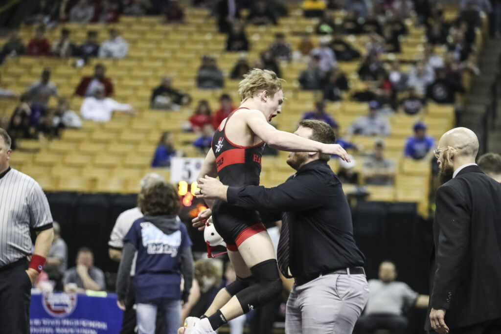 Hannibal’s Cody Culp and coach Borgmeyer celebrate after Culp  wins his 138 pound semifinal match at the class 3 MSHSAA state championships, Saturday in Columbia.  Mathew Kirby