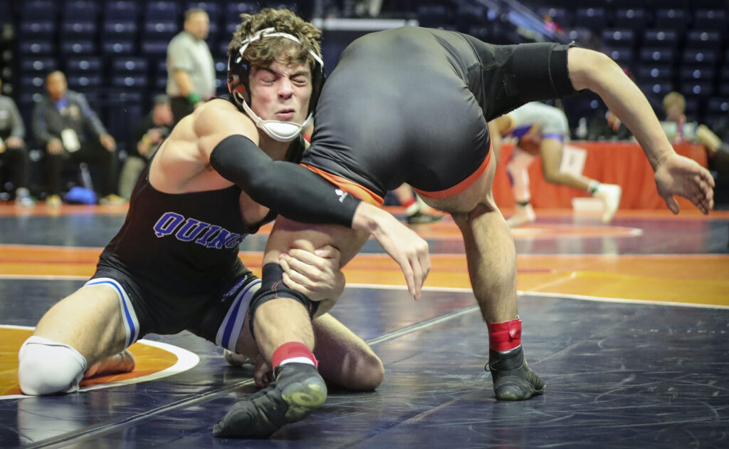 February 17, 2023 - Champaign, Illinois - 
Quincy's Owen Uppinghouse wrestles Hersey's Aaron Hernandez during their match at the 2023 IHSA Individual Wrestling State Finals on Friday. (Photo: PhotoNews Media/Chris Johns)