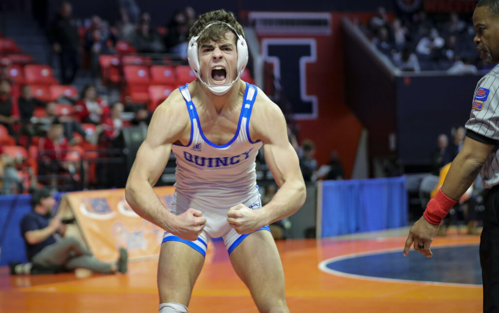 February 18, 2023 - Champaign, Illinois - 
Quincy's Owen Uppinghouse celebrates after pinning Lyons's Gunnar Garelli in their third place match at the 2023 IHSA Individual Wrestling State Finals on Saturday. (Photo: PhotoNews Media/Chris Johns)