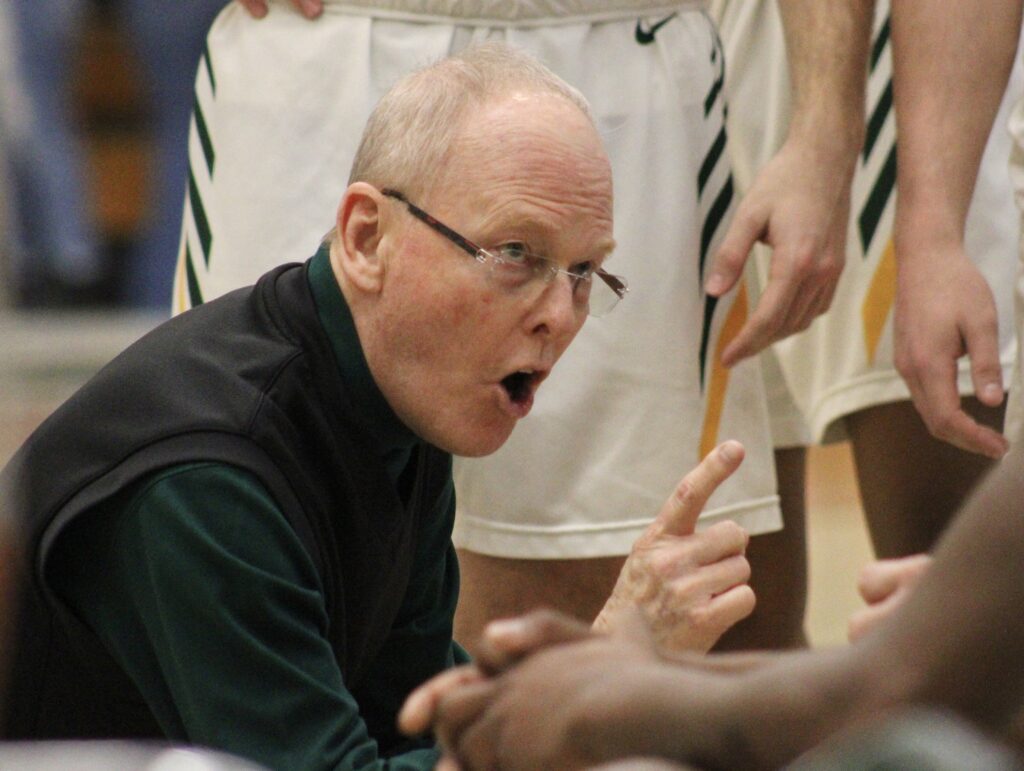 John Wood Community College assistant men's basketball coach Pat Rafferty, who has been coaching nearly a half-century, continues to provide insight for JWCC coach Brad Hoyt and the Trail Blazers. | Matt Schuckman photo