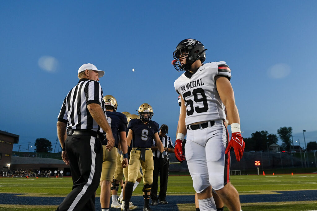 Hannibal senior lineman Noah Young walks off the field after the coin toss prior to Friday night’s game against Jefferson City Helias at Ray Hentges Stadium in Jefferson City, Mo. | Photo courtesy Maya Bell, Jefferson City News Tribune