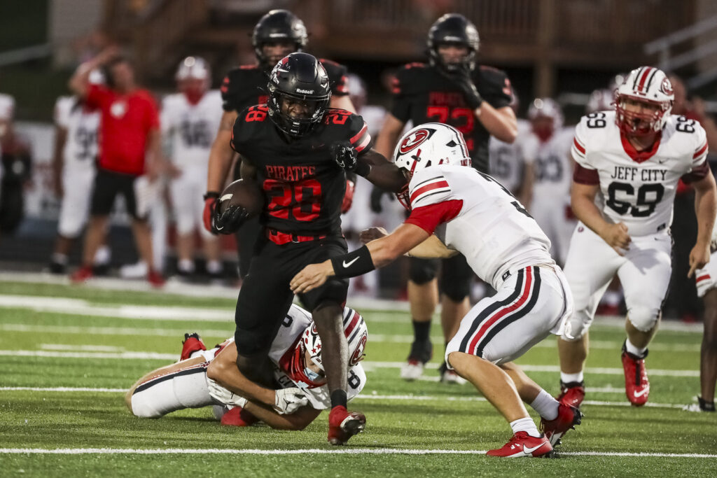 Hannibal’s Mike Ferreira (28) runs the ball during the Pirates game against the Jefferson City Jays, Friday in Hannibal.  Mathew Kirby (Herald Whig/Courier Post)