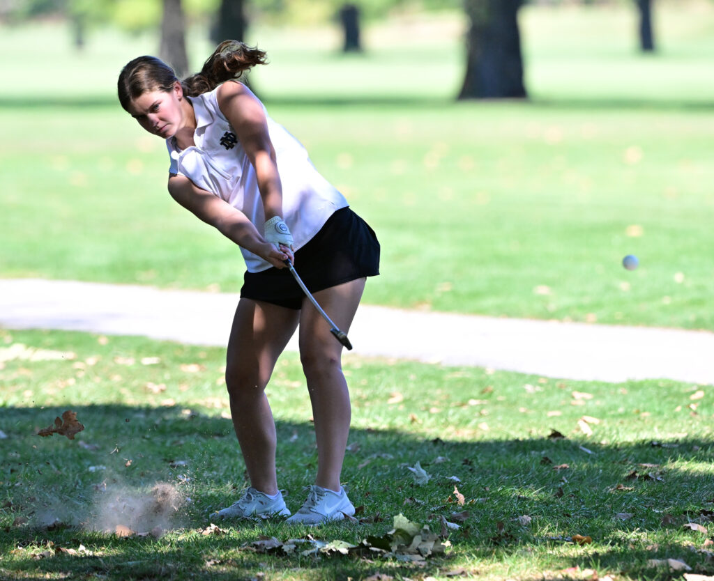Quincy Notre Dame golfer Meredith Eversman chips from the rough onto the sixth fairway. The Class 1A Roxana girls golf sectional was held at Belk Park Golf Course in Wood River, IL on Monday October 2, 2023.  
Photo Courtesy Tim Vizer Photography