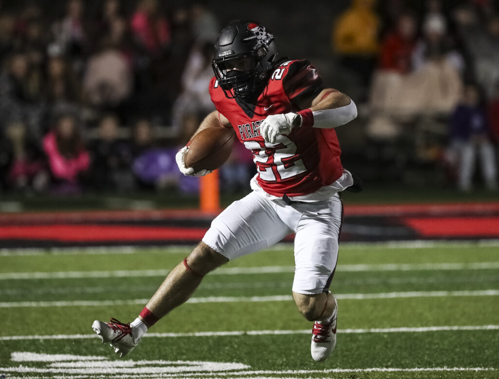 Hannibal’s Aneyas Williams (22) runs the ball during the Hannibal Pirates district game against the St. Charles Pirates, Friday in Hannibal.  Mathew Kirby (Herald WhigCourier Post)