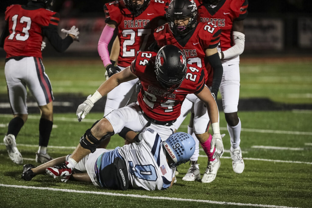 Hannibal’s Kane Wilson (24) tackles St. Charles’ Ezequiel Lopez (9) during the Hannibal Pirates district game against the St. Charles Pirates, Friday in Hannibal.  Mathew Kirby (Herald WhigCourier Post)