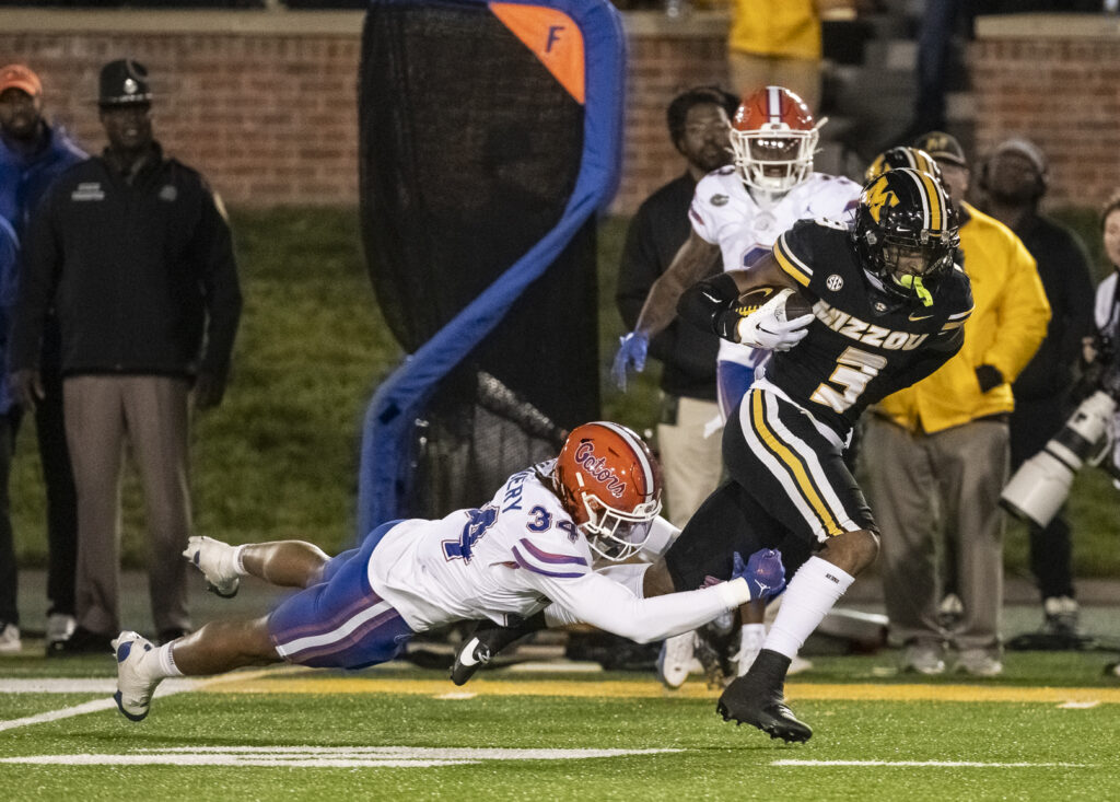 Missouri Tigers wide receiver Luther Burden III (3) runs with the ball during the second half of the SEC football game between the Florida Gators and Missouri Tigers on Nov 18, 2023 in Columbia, MO.  Mathew Kirby.