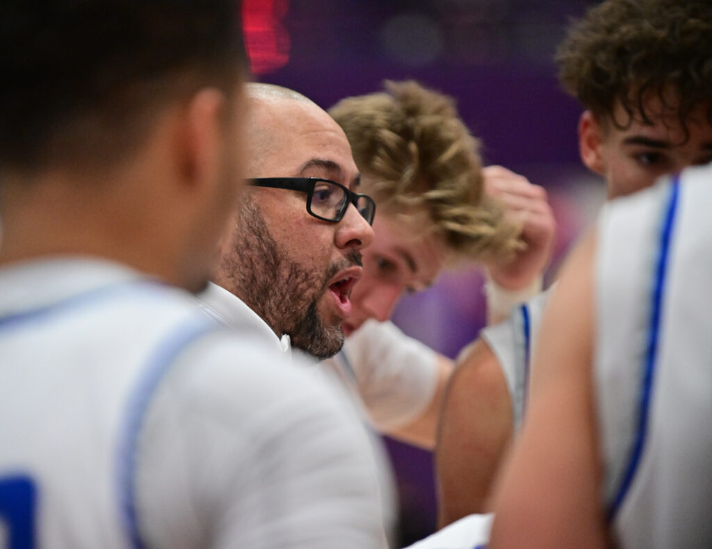 Quincy head coach Andy Douglas talks to his team during a timeout in the final moments of the game. Quincy lost to Collinsville, 44-39, in the championship game of the Collinsville Prairie Farms Holiday Classic at Collinsville High School on Friday December 29, 2023. 
Photo by Tim Vizer for Muddy River Sports