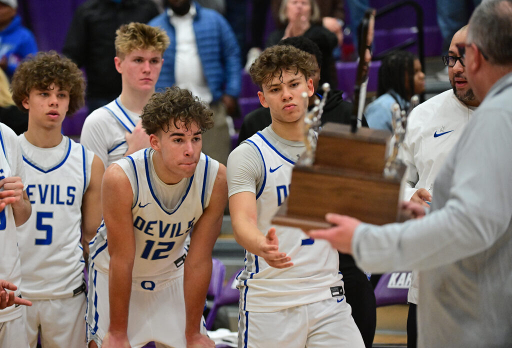 The second place trophy is presented to the Quincy team after they lost to Collinsville, 44-39, in the championship game of the Collinsville Prairie Farms Holiday Classic at Collinsville High School on Friday December 29, 2023. 
Photo by Tim Vizer for Muddy River Sports