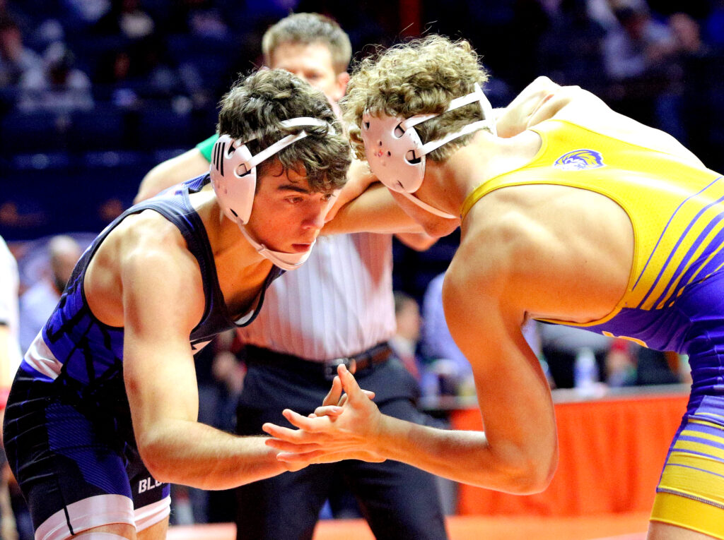 February 16, 2024 - Champaign, Illinois - Quincy's Owen Uppinghouse wrestles Lyons's Gunnar Garelli in their Class 3A 165-pound quarterfinal at the Illinois High School Association Individual Wrestling State Finals. Uppinhouse lost the bout in a 5-1 decision.

(Photo: PhotoNews Media/Clark Brooks)