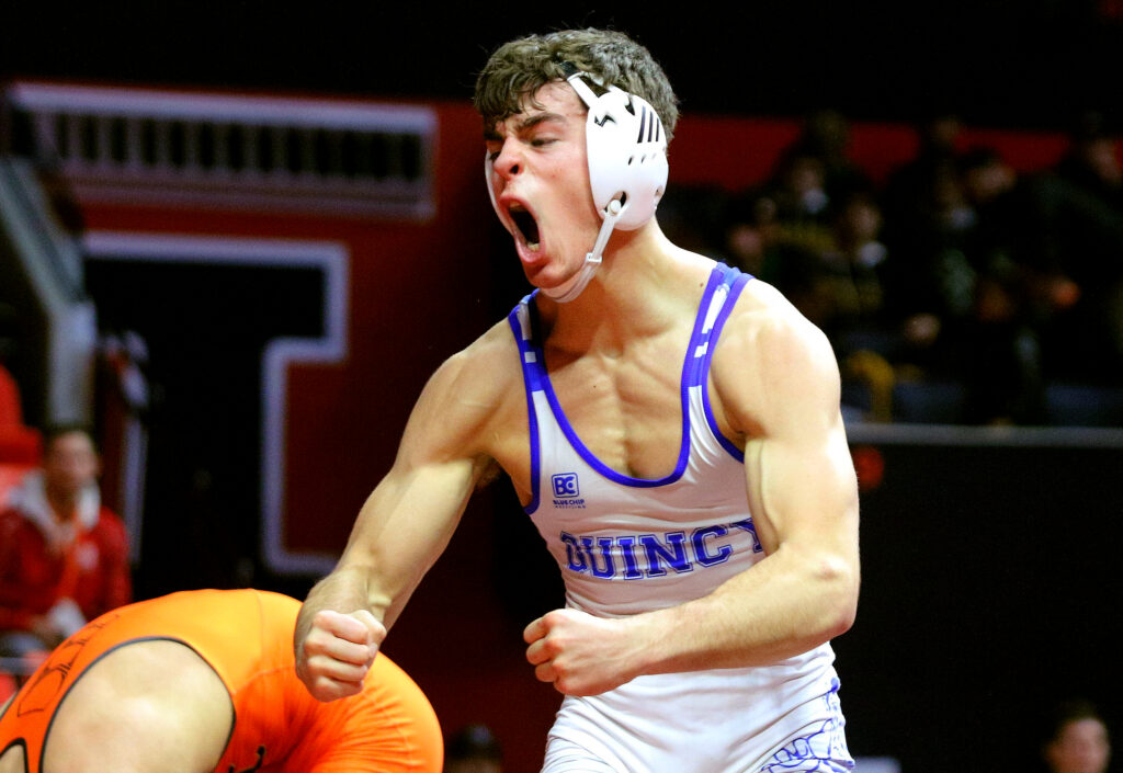 February 17, 2024 - Champaign, Illinois - Quincy's Owen Uppinghouse celebrates his win over St. Charles East's Anthony Gutierrez in their Class 3A 165-pound third-place match at the Illinois High School Association Individual Wrestling State Finals. Uppinghouse won the bout, 7-4.

(Photo: PhotoNews Media/Clark Brooks)
