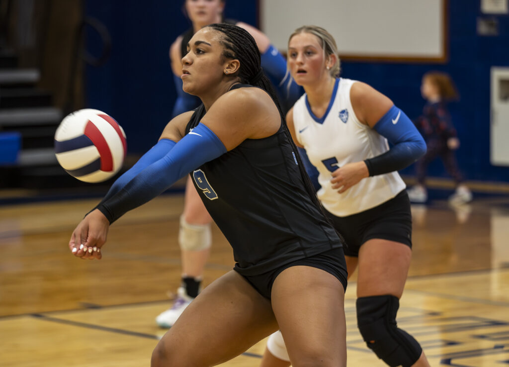 Quincy’s Ayanna Douglas (9) passes the ball during the Blue Devils game against the Hannibal Pirates, Monday in Quincy.  Mathew Kirby (Herald WhigCourier Post)